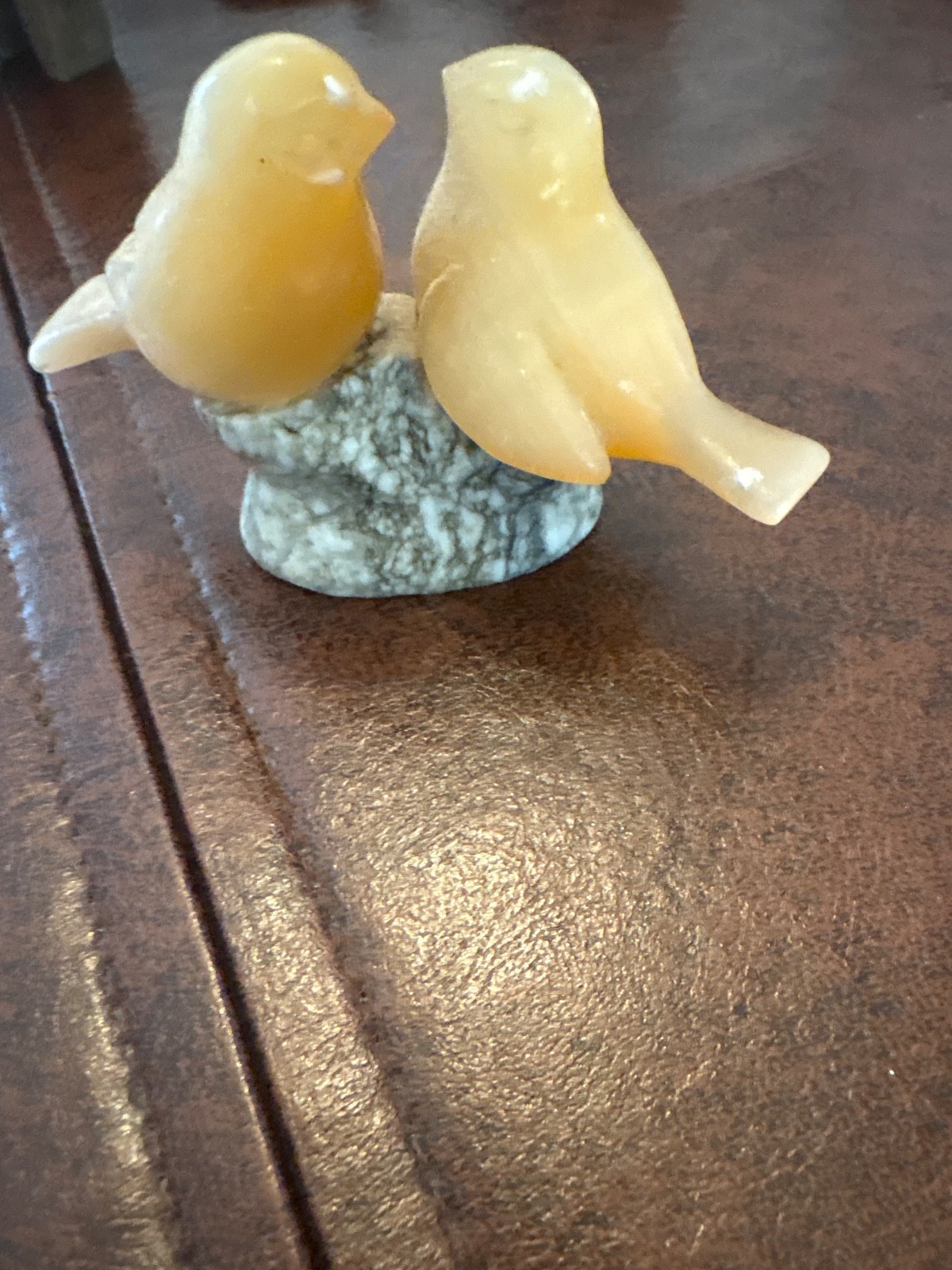 soap stone birds and hedgehog figurines