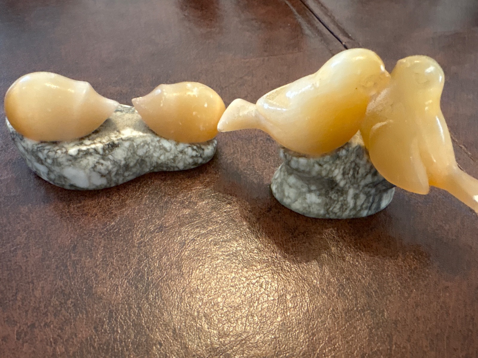 soap stone birds and hedgehog figurines